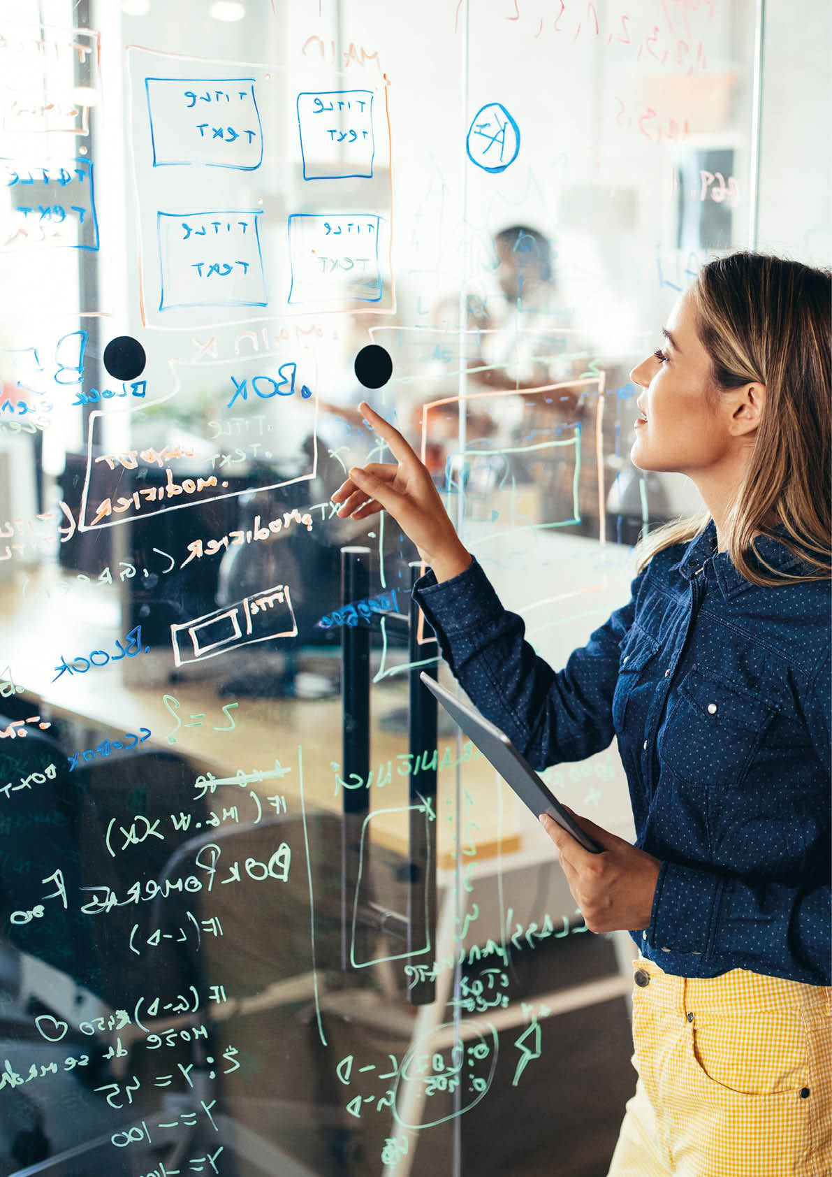 Business solutions, technology, success and strategy concept. Colleagues working and brainstorming in office